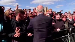 King and Prince William make surprise visit to queue