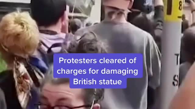 A British court cleared 4 protesters of charges for damaging a statue of a slave