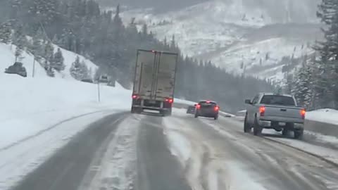 Semi Fishtailing Attempting to Pass Vehicles on Cold Streets