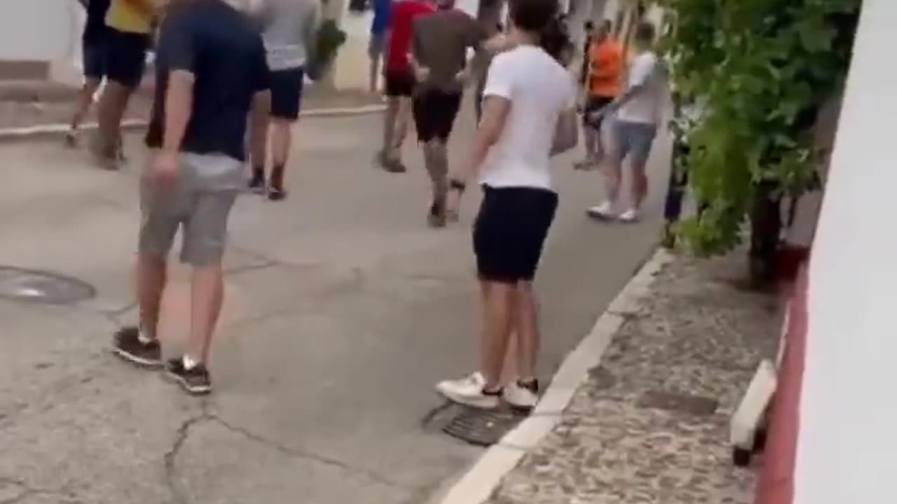 Girl busy with her phone at the middle of bull run