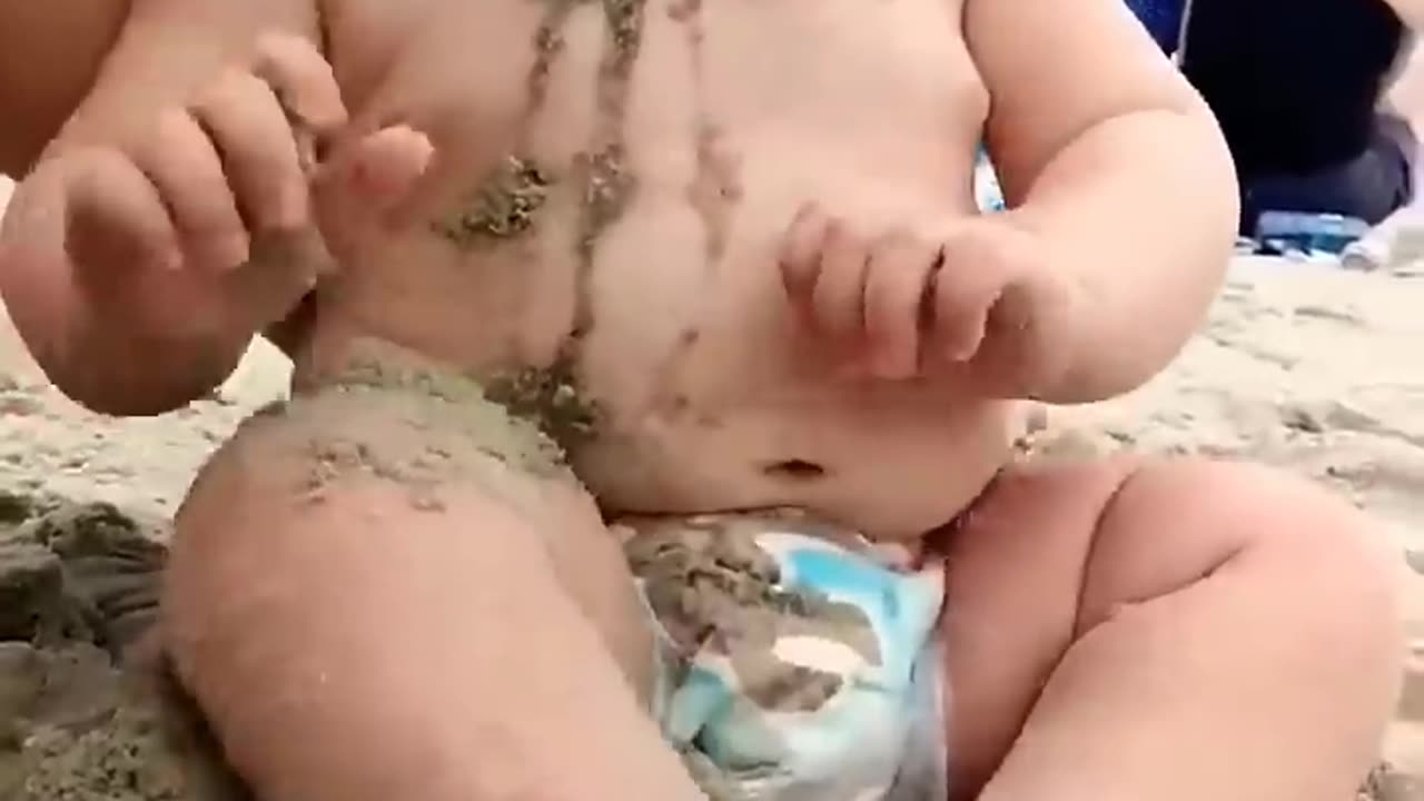 Funny babies reaction on the beach