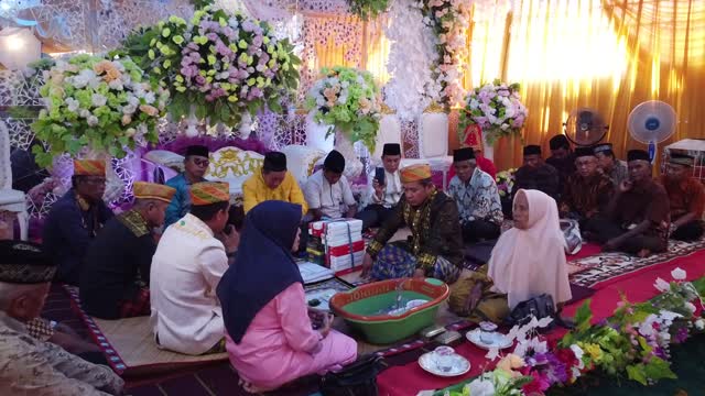 traditional procession & marriage contract of the Tolaki tribe, Southeast Sulawesi, Indonesia