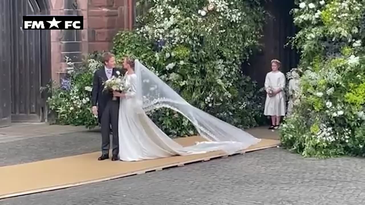 Duke of Westminster and new bride seal wedding with a kiss