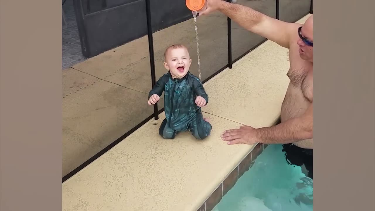 BABIES PLAYING WITH WATER