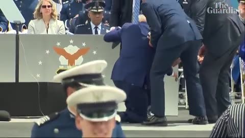 Joe Biden falls on stage at US air force academy ceremony