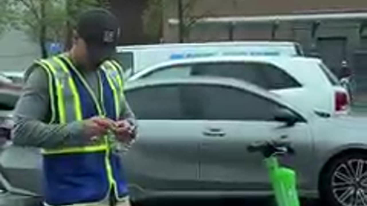 Man Picks up groceries on a scooter