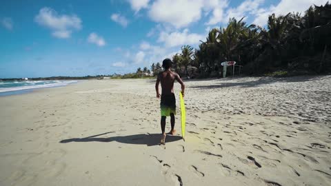 Surfing Man on the seashore