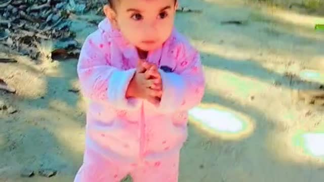 My daughter is walking happily.