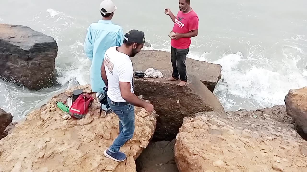 Pakistan Karachi Du Dariya covering fishermen on the beach