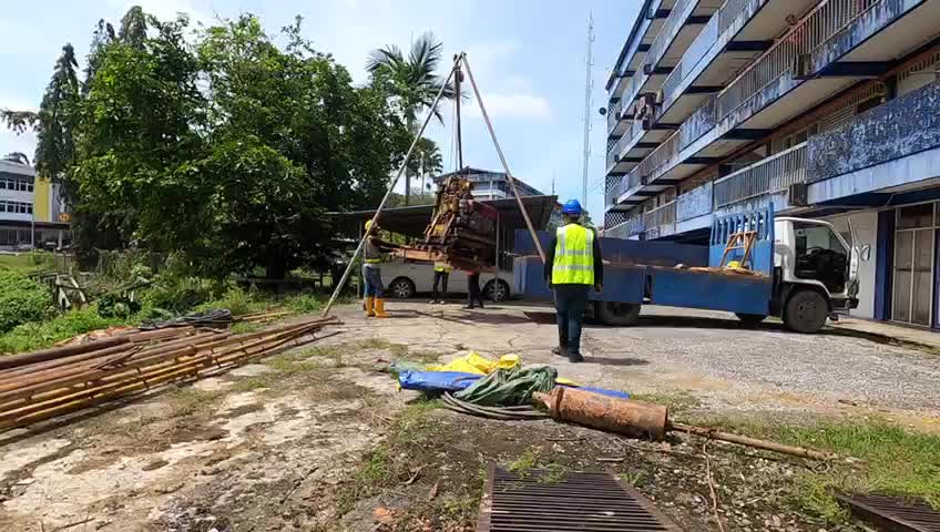 Lifting borehole machine from the lorry ( Soil investigation)