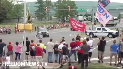 Biden's motorcade passes the crowd