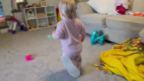 Little Girl Wears Mom's Slippers