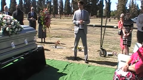 MOV059-Palbearers-casket-at-cemetery