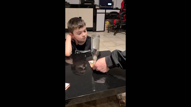Boy Outsmarts Dad and Pulls Money Bill Kept Under Bottle Without Touching It