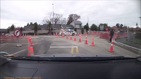 Driver on Wrong Side of One-Way Gets Instantly Tailed By Police Car