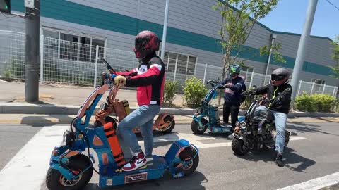 Electric Scooter WEPED Cyberfold and Dark Knight ride together