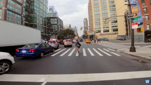 Bike Messenger Riding Fast and Fluid Through NYC Traffic