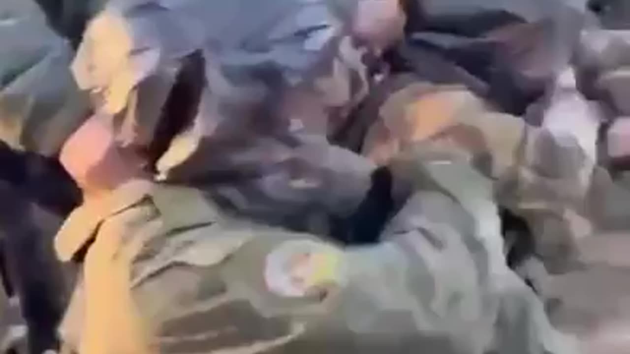 Russian soldiers training to apply a tourniquet with plastic bags on their heads