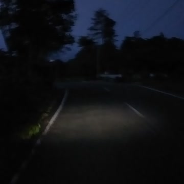 view of the road in the hills at night