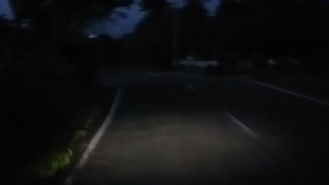 view of the road in the hills at night