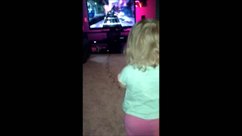 Toddler Rocks Out On Guitar Hero