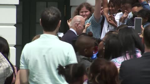 A Staffer's Child Unsuccessfully Attempts To Wrangle A Wandering Biden Back Into The Oval Office