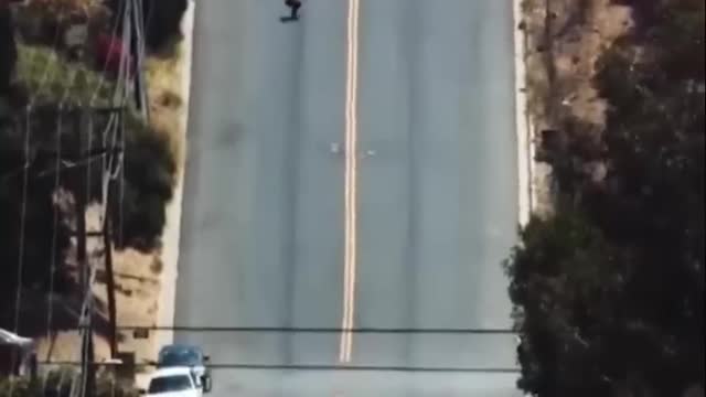 Guy Skateboards Down MASSIVE Hill with Traffic