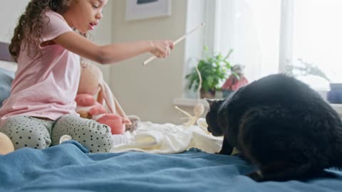 kids playing with cat