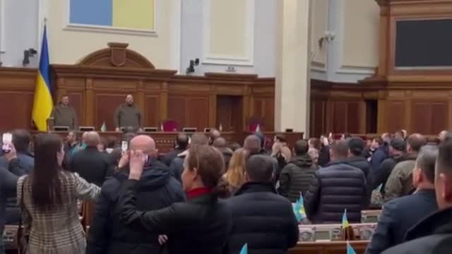 StoryiunMembers of the Ukrainian Parliment sing thein national anthem at a security meeting in Kyiv