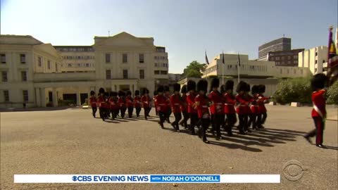 The Queen's Guards try not to faint as temperatures soar