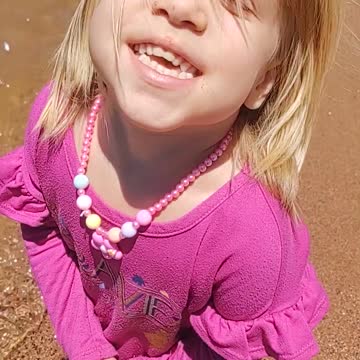 Adorable young girl at the beach