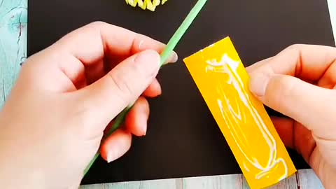 Origami - hand holding paper flower