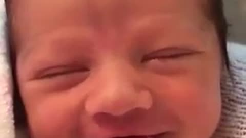 This might be the happiest newborn baby I've ever seen