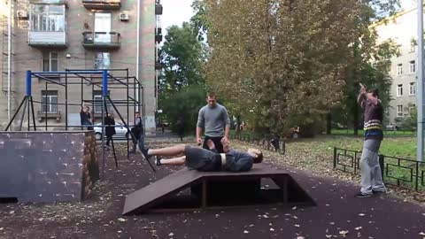 Guy Doing A Parkour Jump Lands Hard On His Back