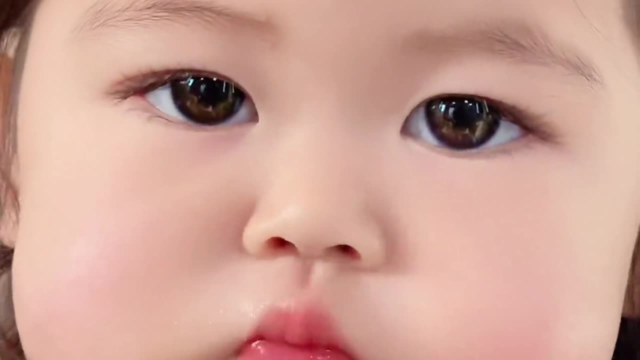 Cute Baby Girl eating Luttece with chopstick