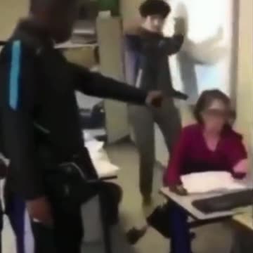 school kid pulls a gun out on a teacher