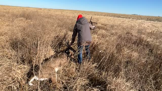 Wife walks up on her biggest buck yet.