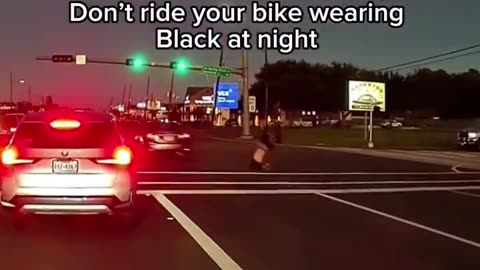 Biker crosses the street on a red light