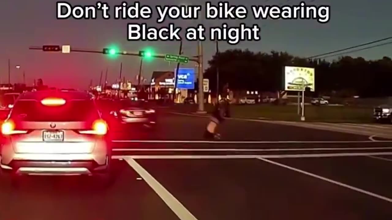 Biker crosses the street on a red light - gets smacked