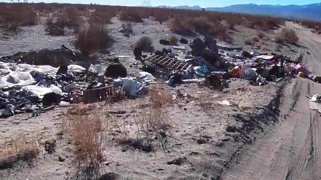 trashing earth = the massive amounts of discarded trash in desolate areas of socal