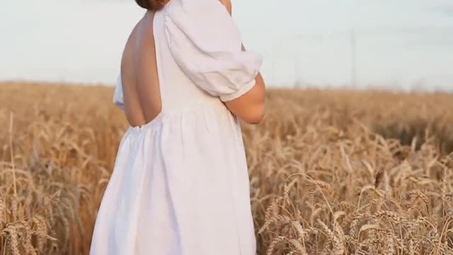 Beautiful Girl Walking Down The Field