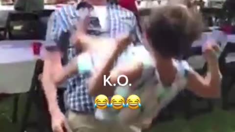 man gets ko'd by a kid on a swing