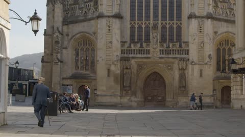 Wide Shot of Pedestrians In Abbey Churchyard