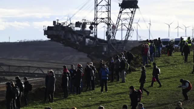 Climate activists dig in to defend village from coal mine