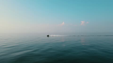 Man On Jet Ski Speedy Across Sea