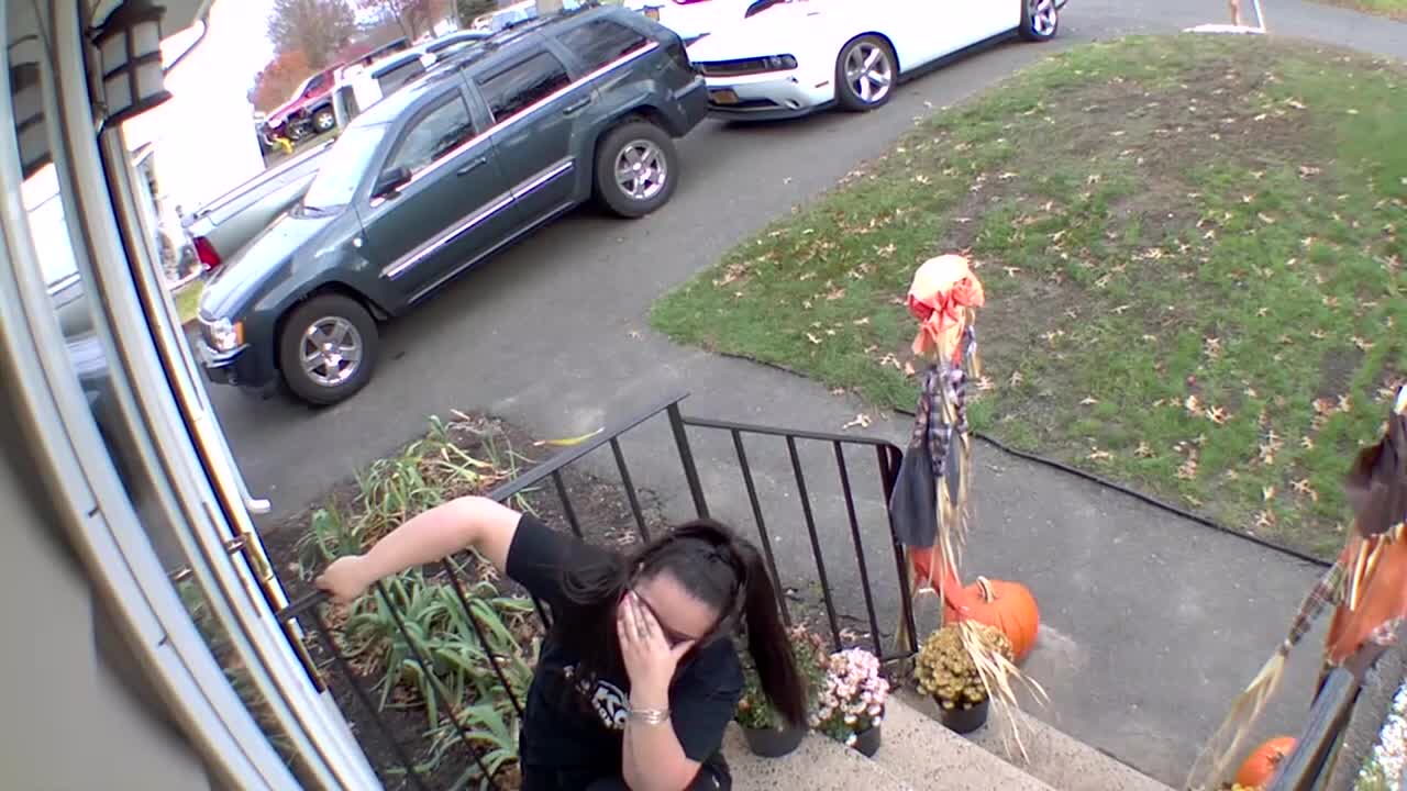 Woman Stumbles And Falls, Crashing Into The Front Door While Going Up The Stairs