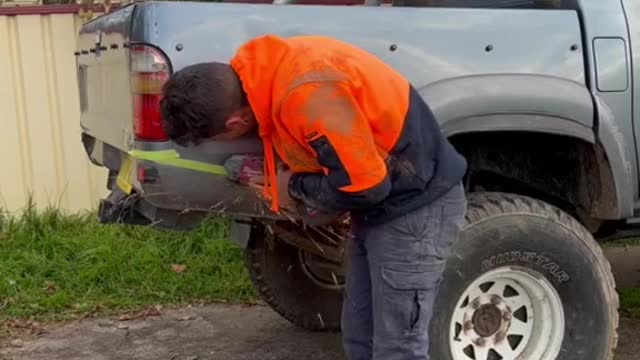 Retrofitting a truck spare tire storage rod.