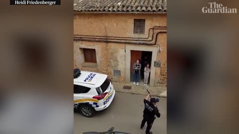 Spanish police sing to families during coronavirus lockdown in Mallorca