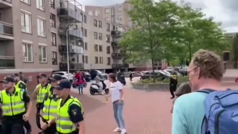 Child screams as Dutch police baton the public in Almelo who have gathered in support