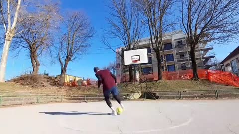 Guy Lands a Rainbow Flick Trick Shot in Basketball Net